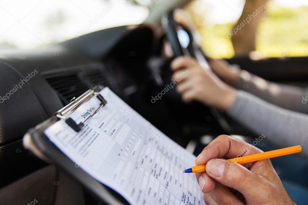 depositphotos_99313680-stock-photo-student-driver-taking-driving-test